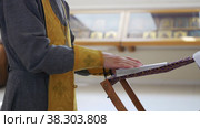 RUSSIA, KAZAN 08-28-2022: Christian priest turns the page of the Bible on the stand. Редакционное видео, видеограф Константин Шишкин / Фотобанк Лори
