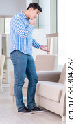 Young man shopping in furniture store. Стоковое фото, фотограф Elnur / Фотобанк Лори
