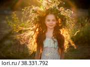 Cute smiling little girl with flower wreath on the meadow at the farm. Portrait of adorable small kid outdoors. Midsummer. Стоковое фото, фотограф Юлия Тарасова / Фотобанк Лори