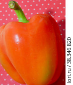 Sweet red bell pepper on a red background with polka dots. Стоковое фото, фотограф Елена Бобкова / Фотобанк Лори