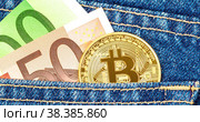 Euro banknotes and Bitcoin sticking out of the jeans pocket. Стоковая анимация, аниматор FotograFF / Фотобанк Лори