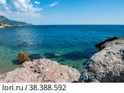 Laspi Bay and view of Mount Ilyas-Kaya Crimea. Bright sunny Cloudless Day. View of the beach Batiliman. Clear turquoise sea water. Vacation by the sea. A wild rocky beach in the Crimea. Стоковое фото, фотограф Оксана Медведева / Фотобанк Лори