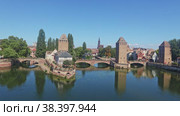 Picturesque Strasbourg cityscape overlooking medieval arched Ponts Couverts and watchtowers seen from viewing platform of Barrage Vauban on sunny summer day, France. Стоковое видео, видеограф Яков Филимонов / Фотобанк Лори