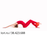 Gymnast girl in a red jumpsuit does an exercise with ball on white background, isolate. Стоковое фото, фотограф Мария Мороз / Фотобанк Лори