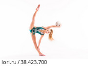 Gymnast girl in an emerald swimsuit performs an exercise with a ball isolated on white background. Стоковое фото, фотограф Мария Мороз / Фотобанк Лори