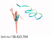 Gymnast girl in an emerald swimsuit performs an exercise with ribbon isolated on white background. Стоковое фото, фотограф Мария Мороз / Фотобанк Лори