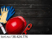 Hardhat and gloves of construction worker top view. Стоковое фото, фотограф Сергей Толмачёв / Фотобанк Лори