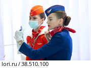 Россия. Санкт-Петербург. Стюардессы авиакомпании. Бортпроводники группы компаний "Аэрофлот". Russia. Saint-Petersburg. Airline flight attendants. Flight attendants of the Aeroflot Group of companies (2021 год). Редакционное фото, фотограф Алексей Смышляев / Фотобанк Лори