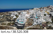 Oia village Santorini with whitewashed house and swimming pools Santorini Greece Europe. Стоковое видео, видеограф Fokke Baarssen / Фотобанк Лори