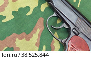 Russian army handgun on camouflage background. Стоковое видео, видеограф FotograFF / Фотобанк Лори