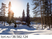 Winter landscape of Ruskeala Park. Ruskeala waterfalls under snow at sunset and suspension bridges. Beautiful winter landscape. Russia, Republic of Karelia. (2018 год). Стоковое фото, фотограф Photojuli / Фотобанк Лори