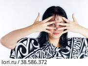 Pretty woman covering eyes. Стоковое фото, фотограф Сергей Буторин / Фотобанк Лори