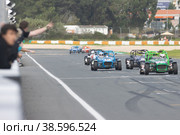 11-20-2022 PORTUGAL, LISBON: Caterham Festival Estoril - karts of different colors drive along the race track. Редакционное фото, фотограф Константин Шишкин / Фотобанк Лори