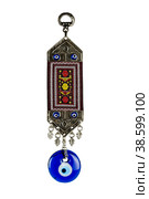 Traditional Turkish amulet against the evil eye. A souvenir from Turkey. A glass Turkish eye isolated on a white background. (2022 год). Редакционное фото, фотограф Светлана Качанова / Фотобанк Лори
