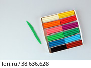 Set of multicolored modeling clay on blue surface. Стоковое фото, фотограф Попова Ольга / Фотобанк Лори