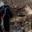 A grown man wearing a mask, wearing a jacket with a hood, wearing military pants, wearing gloves aims at a weapon. Стоковое фото, фотограф Владимир Арсентьев / Фотобанк Лори
