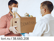 Donation box of food for people suffering from coronavirus pandemia. Стоковое фото, фотограф Сергей Толмачёв / Фотобанк Лори