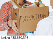 Donation box of food for people suffering from coronavirus pandemia. Стоковое фото, фотограф Сергей Толмачёв / Фотобанк Лори