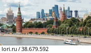 Moscow, Russia-July 25, 2020: View of Moscow on a summer day. capital of Russia. Grand Kremlin palace. Kremlin embankment. Moscow-river. Towers Of Moscow City. Popular tourist attraction. Редакционное фото, фотограф Photojuli / Фотобанк Лори