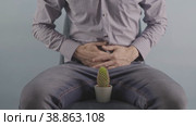 European a man holds his stomach and shows pain urology problem. Стоковое видео, видеограф Mihail Mihaylov / Фотобанк Лори
