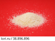 heap of gelatin on a red background. joint supplement. Стоковое фото, фотограф Поликарпов Владимир Владимирович / Фотобанк Лори