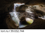 Saltinsky, an underground waterfall in Dagestan - a natural landmark (2021 год). Редакционное фото, фотограф Анна Костенко / Фотобанк Лори