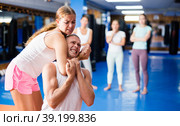 Young woman performing chokehold. Стоковое фото, фотограф Яков Филимонов / Фотобанк Лори