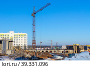 Construction of a multi-storey residential building using the method of monolithic construction using a tower crane. Стоковое фото, фотограф Дмитрий Коростылев / Фотобанк Лори