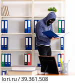 Male thief in balaclava in the office. Стоковое фото, фотограф Elnur / Фотобанк Лори