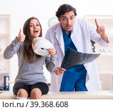 Young male doctor and female beautiful patient. Стоковое фото, фотограф Elnur / Фотобанк Лори