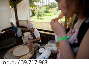 Woman cooking cakes gozleme. Hotel in Turkey (2018 год). Редакционное фото, фотограф Сергей Буторин / Фотобанк Лори
