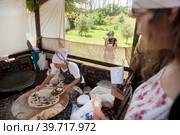 Woman cooking cakes gozleme. Hotel in Turkey (2018 год). Редакционное фото, фотограф Сергей Буторин / Фотобанк Лори