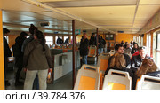 Интерьер пассажирского парома. Паромная пристань Касильяс (Cacilhas ferries terminal). Алмада, Сетубал, Португалия (2023 год). Редакционное фото, фотограф lana1501 / Фотобанк Лори