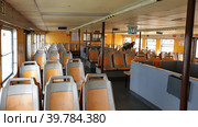 Интерьер пассажирского парома. Паромная пристань Касильяс (Cacilhas ferries terminal). Алмада, Сетубал, Португалия (2023 год). Редакционное фото, фотограф lana1501 / Фотобанк Лори