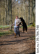 Dog bites woman. Стоковое фото, фотограф Lekcej / Фотобанк Лори