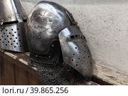 Steel helmet of medieval knight with opening visor. Стоковое фото, фотограф EugeneSergeev / Фотобанк Лори