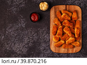 Chicken naggets with sauces on dark background. Стоковое фото, фотограф Татьяна  Бральнина / Фотобанк Лори