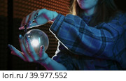 A young woman playing with a glass ball - contact juggling. Стоковое видео, видеограф Константин Шишкин / Фотобанк Лори