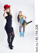 Danger young woman with chainsaw. Стоковое фото, фотограф Сергей Буторин / Фотобанк Лори