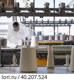 Spools with thread at rewinding machine. Стоковое фото, фотограф Гурьянов Андрей / Фотобанк Лори