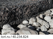 Gabion and rough stones at the roadside. Стоковое фото, фотограф EugeneSergeev / Фотобанк Лори