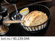 Sliced artisanal white bread with spicy herb butter. Стоковое фото, фотограф Яков Филимонов / Фотобанк Лори