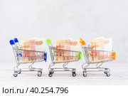 Shopping cart with Russian rubles inside. Стоковое фото, фотограф Корнеев Вячеслав / Фотобанк Лори