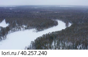 Западная Сибирь: вид на зимнюю тайгу с воздуха. Western Siberia: a view of the winter taiga from the air. Стоковое видео, видеограф Евгений Романов / Фотобанк Лори