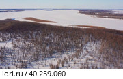 Западная Сибирь: река Обь зимой. Вид с воздуха. Western Siberia: the Ob River in winter. Aerial view. Стоковое видео, видеограф Евгений Романов / Фотобанк Лори