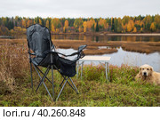 Tourist collapsible chair on the background of the autumn landscape. Стоковое фото, фотограф Александр Поташев / Фотобанк Лори