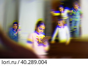 Tween children solving riddles in quest room., toned image. Стоковое фото, фотограф Яков Филимонов / Фотобанк Лори