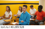 Different aged multiracial men and women studying in taxi driving school. Стоковое видео, видеограф Яков Филимонов / Фотобанк Лори
