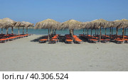 Video of Elafonisi Beach with sunbeds and umbrellas made from woven palm leaf. Crete, Greece. Стоковое видео, видеограф Сергей Пристяжнюк (Serg Zastavkin) / Фотобанк Лори