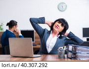 Two employees doing sport exercises in the office. Стоковое фото, фотограф Elnur / Фотобанк Лори